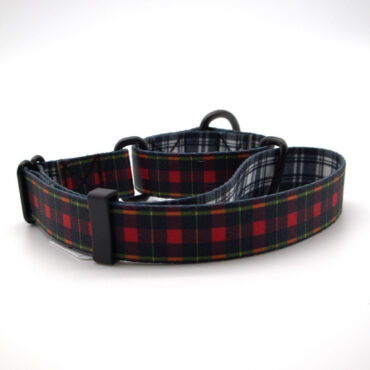 Red and black plaid dog collar with adjustable buckle and metal ring on a white background. Perfect for stylish pets.